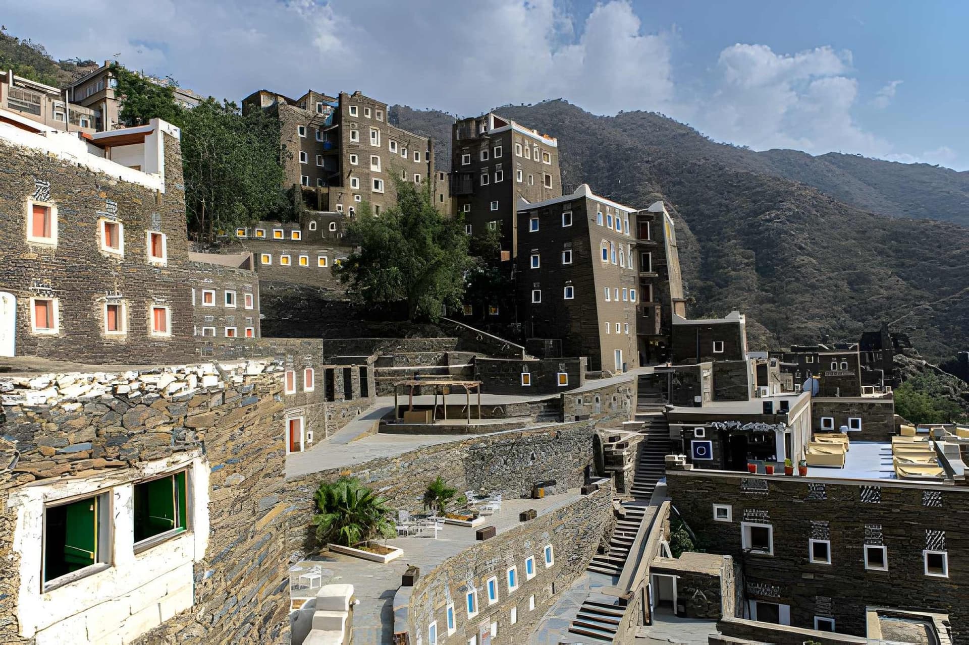 A stone village in the Asir highlands with mountains behind it